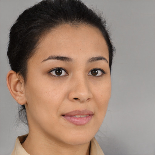 Joyful asian young-adult female with short  brown hair and brown eyes