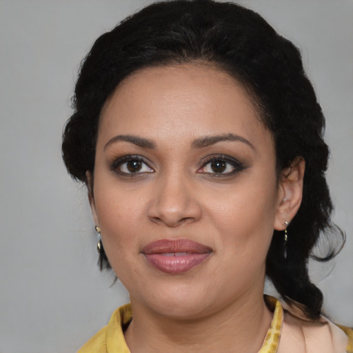 Joyful black young-adult female with medium  brown hair and brown eyes