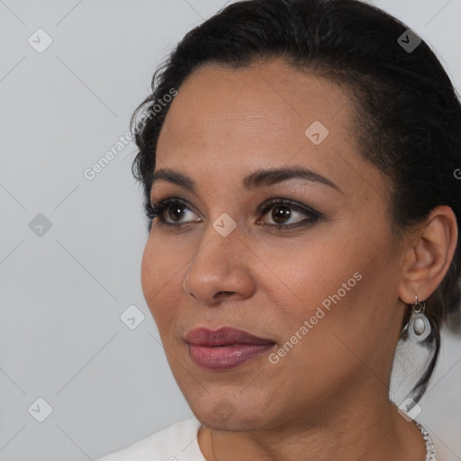 Joyful latino young-adult female with short  brown hair and brown eyes