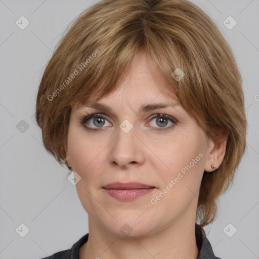 Joyful white adult female with medium  brown hair and grey eyes