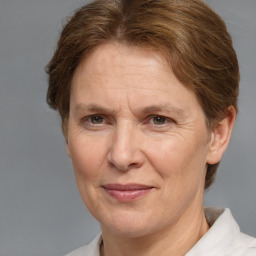 Joyful white middle-aged female with short  brown hair and brown eyes