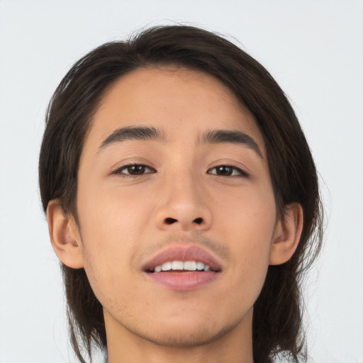 Joyful asian young-adult male with medium  brown hair and brown eyes