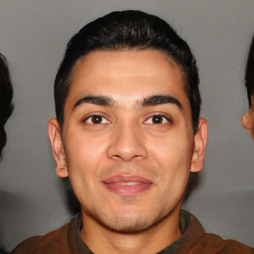 Joyful white young-adult male with short  black hair and brown eyes