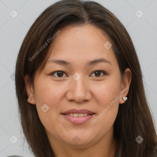 Joyful white adult female with long  brown hair and brown eyes