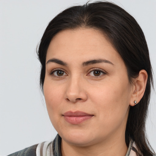 Joyful white young-adult female with medium  brown hair and brown eyes