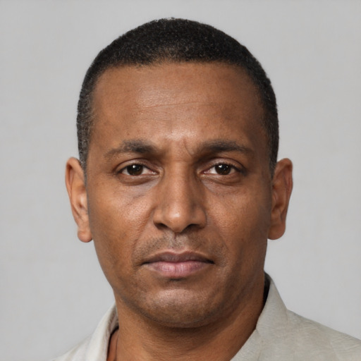 Neutral black adult male with short  brown hair and brown eyes