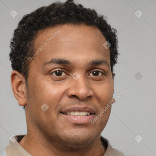 Joyful latino young-adult male with short  brown hair and brown eyes