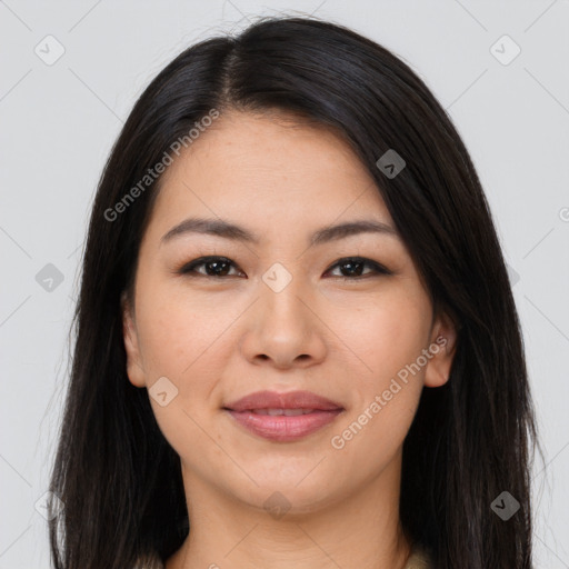 Joyful latino young-adult female with long  brown hair and brown eyes