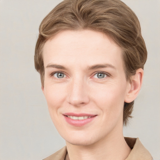 Joyful white young-adult female with medium  brown hair and grey eyes