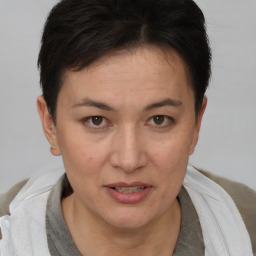 Joyful white adult female with short  brown hair and brown eyes
