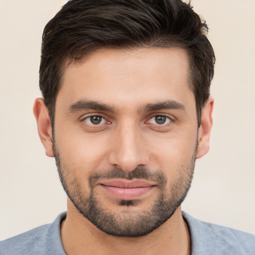 Joyful white young-adult male with short  brown hair and brown eyes