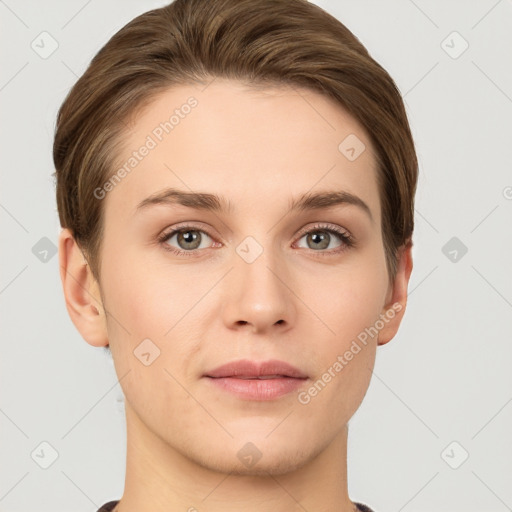 Joyful white young-adult female with short  brown hair and grey eyes