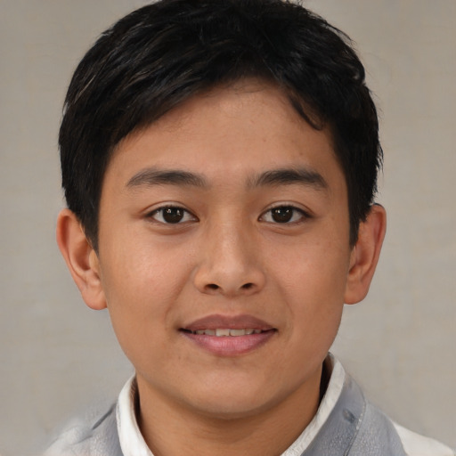 Joyful latino young-adult male with short  brown hair and brown eyes