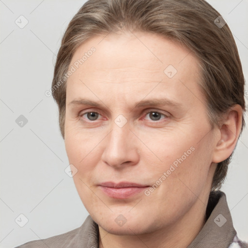 Joyful white adult male with medium  brown hair and grey eyes