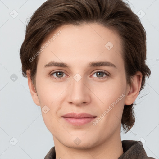 Joyful white young-adult female with short  brown hair and grey eyes