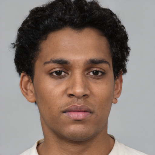 Neutral black young-adult male with short  brown hair and brown eyes