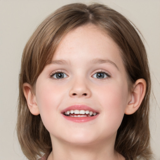 Joyful white child female with medium  brown hair and grey eyes