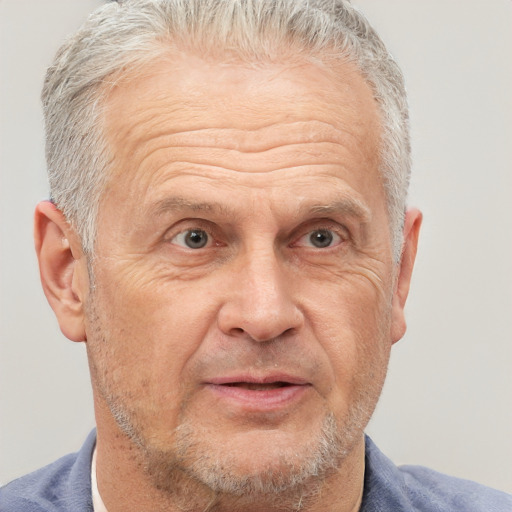 Neutral white middle-aged male with short  gray hair and brown eyes