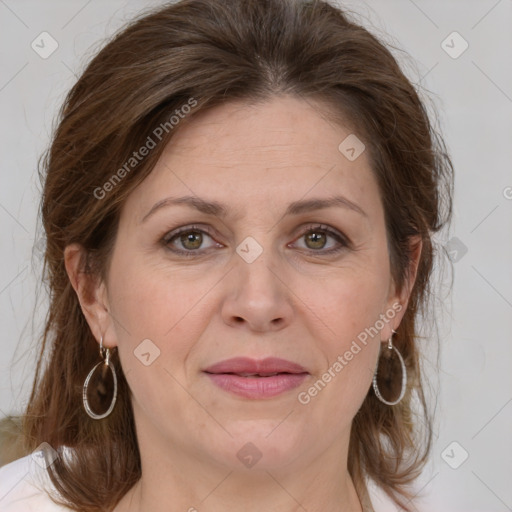 Joyful white adult female with medium  brown hair and grey eyes