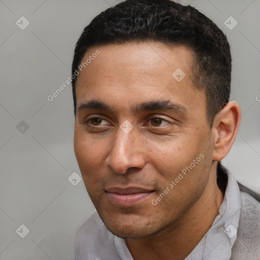 Joyful latino young-adult male with short  black hair and brown eyes