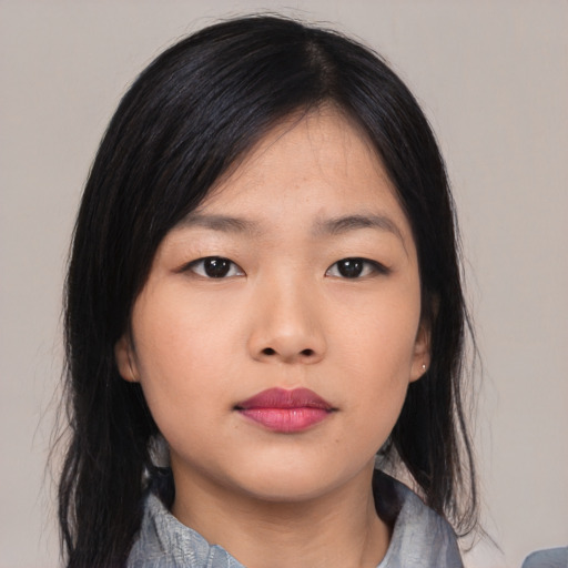 Neutral asian young-adult female with medium  black hair and brown eyes