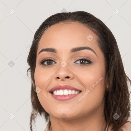 Joyful white young-adult female with long  brown hair and brown eyes