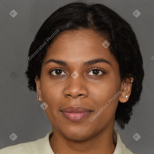 Joyful black young-adult female with short  brown hair and brown eyes