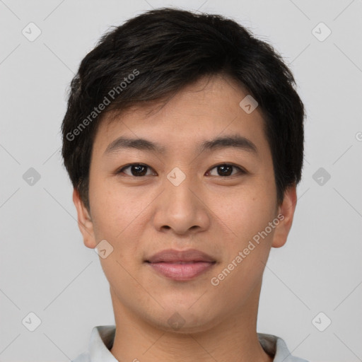 Joyful asian young-adult male with short  brown hair and brown eyes