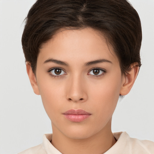 Neutral white young-adult female with short  brown hair and brown eyes