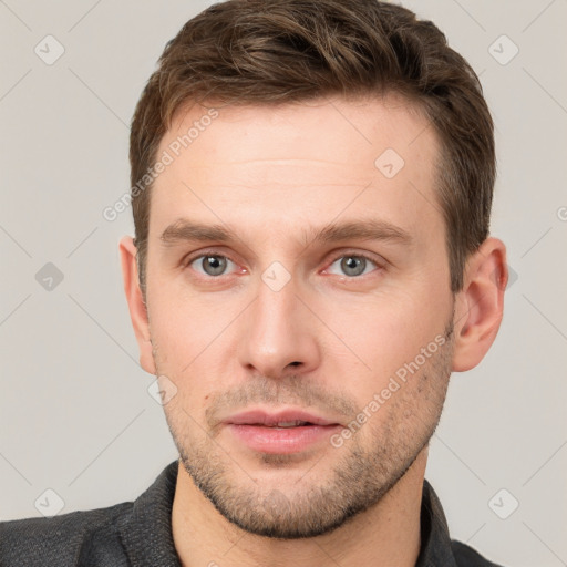 Neutral white young-adult male with short  brown hair and grey eyes