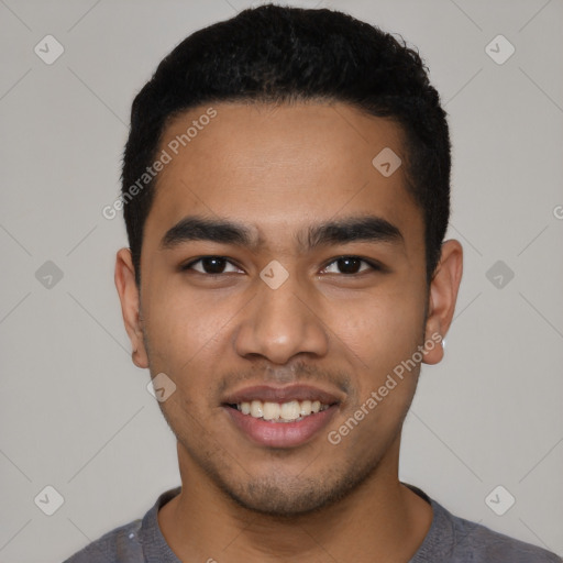 Joyful latino young-adult male with short  black hair and brown eyes