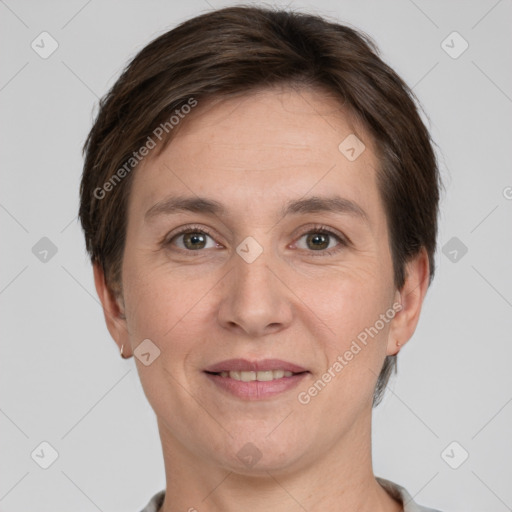 Joyful white adult female with short  brown hair and grey eyes