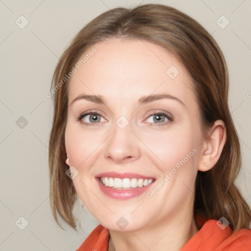 Joyful white young-adult female with medium  brown hair and blue eyes