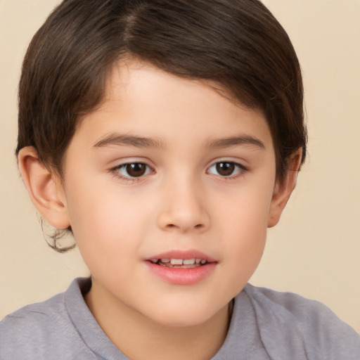 Joyful white child male with short  brown hair and brown eyes