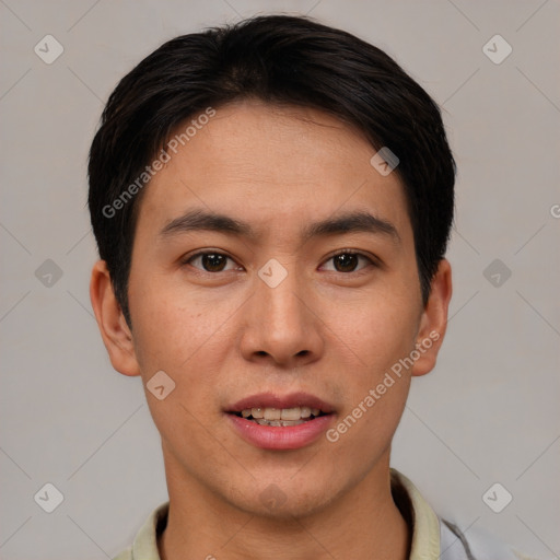 Joyful asian young-adult male with short  brown hair and brown eyes