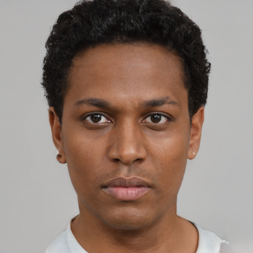 Neutral black young-adult male with short  black hair and brown eyes