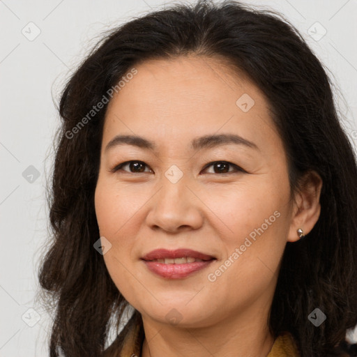 Joyful asian adult female with long  brown hair and brown eyes