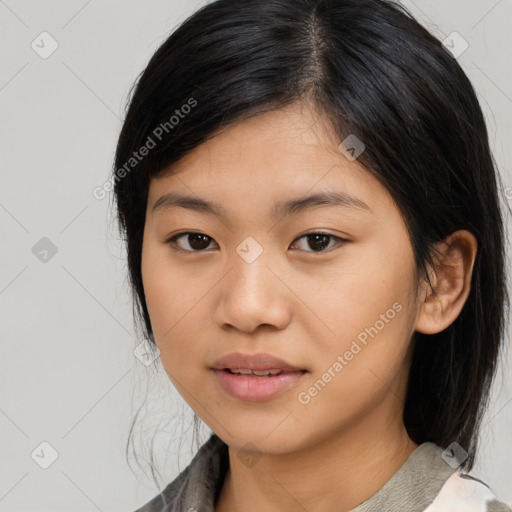 Joyful asian young-adult female with medium  black hair and brown eyes