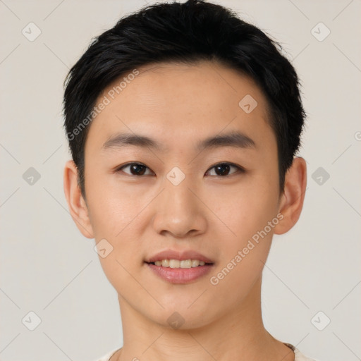 Joyful asian young-adult male with short  black hair and brown eyes