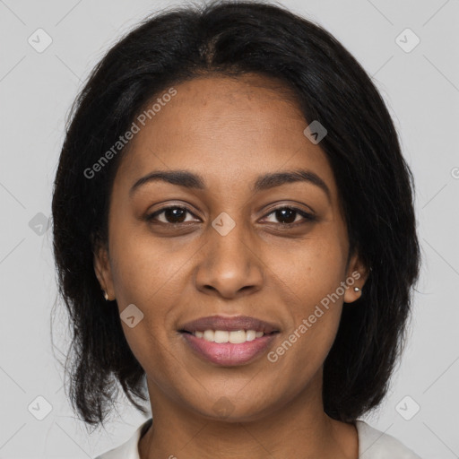 Joyful black young-adult female with medium  black hair and brown eyes