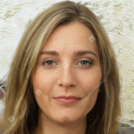 Joyful white young-adult female with long  brown hair and green eyes