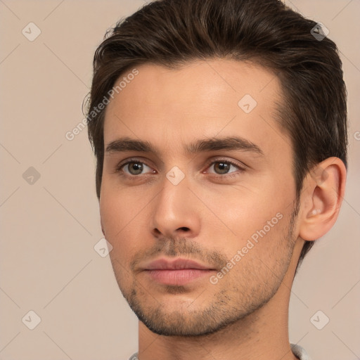 Neutral white young-adult male with short  brown hair and brown eyes