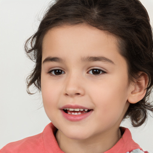 Joyful white child female with medium  brown hair and brown eyes