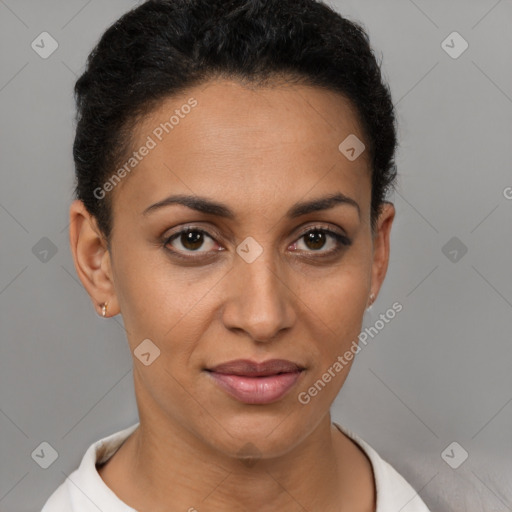 Joyful latino young-adult female with short  brown hair and brown eyes