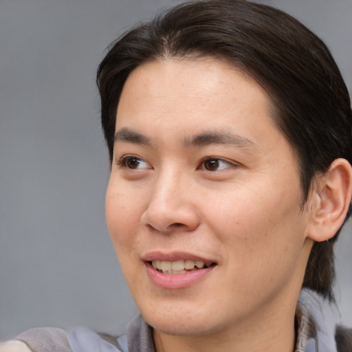 Joyful white young-adult male with medium  brown hair and brown eyes