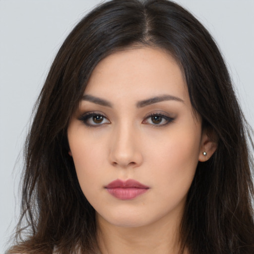 Neutral latino young-adult female with long  brown hair and brown eyes