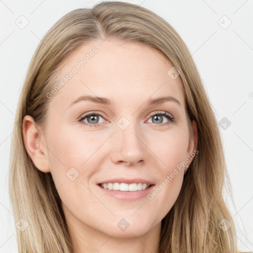 Joyful white young-adult female with long  brown hair and blue eyes