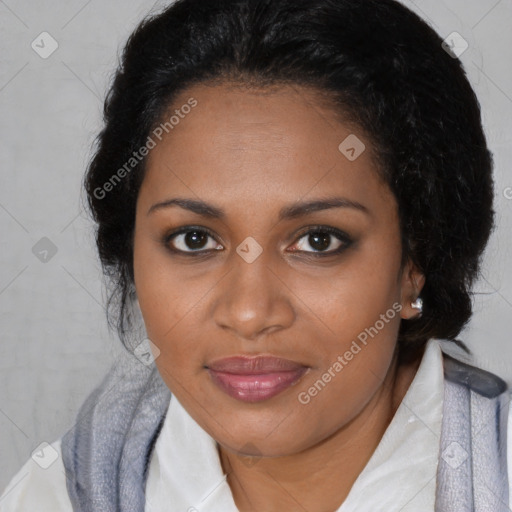 Joyful black young-adult female with long  brown hair and brown eyes