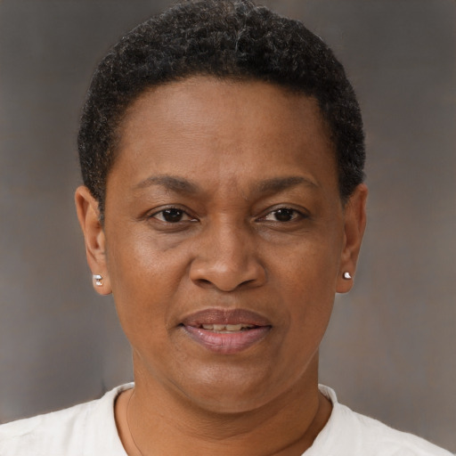 Joyful black adult female with short  brown hair and brown eyes
