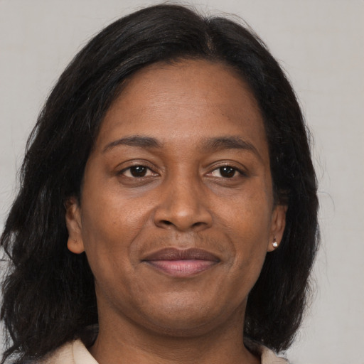 Joyful asian adult female with medium  brown hair and brown eyes